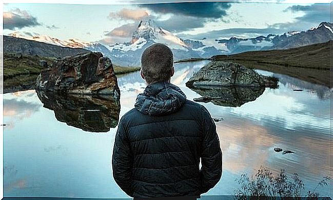 Boy in front of a lake