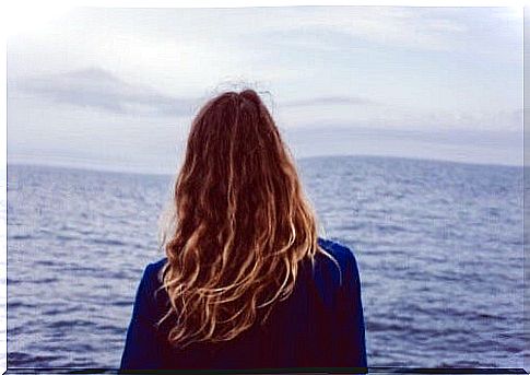 Woman looking at the sea.