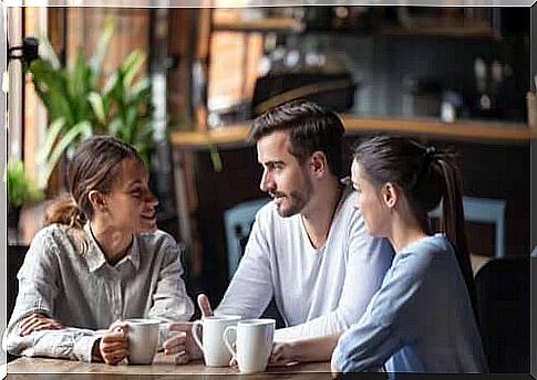 Group of friends talking in a coffee shop