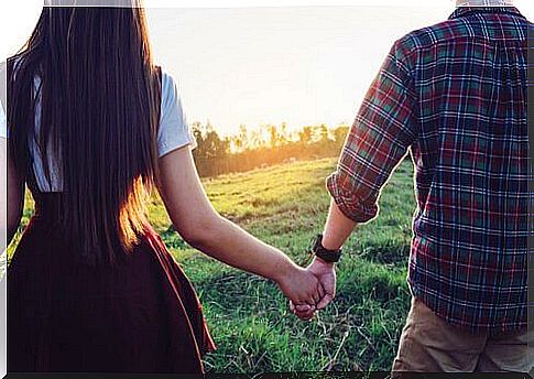 Couple holding hands