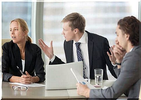 People discussing at a business meeting.