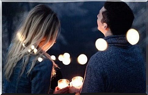 Happy couple with candles.