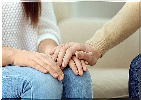 Psychologist hand on the patient's hand