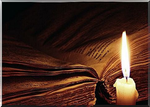 Open book with candle