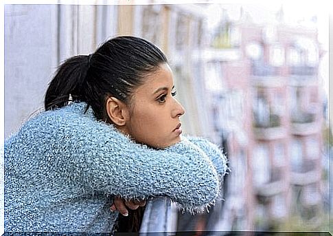 Girl looking out to the balcony