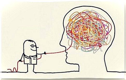 Psychologist extracting a thread from a tangle inside a head