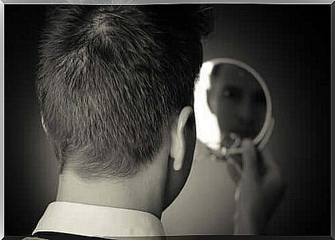 Man looking in the mirror